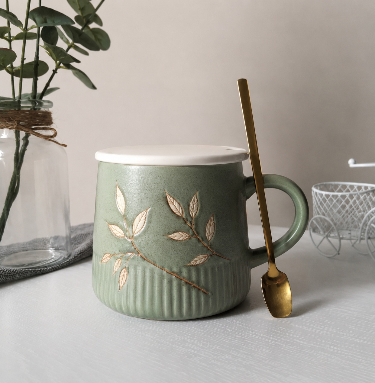 Premium sage green ceramic cup with an elegant botanical design.