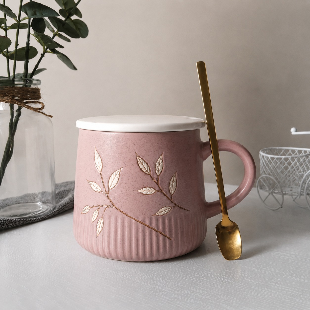 Premium mauve pink ceramic cup with an elegant botanical design.